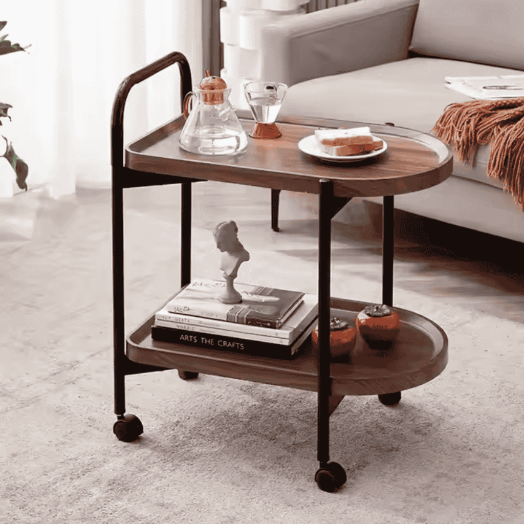 Wooden serving cart with decorative items in a living room setting
