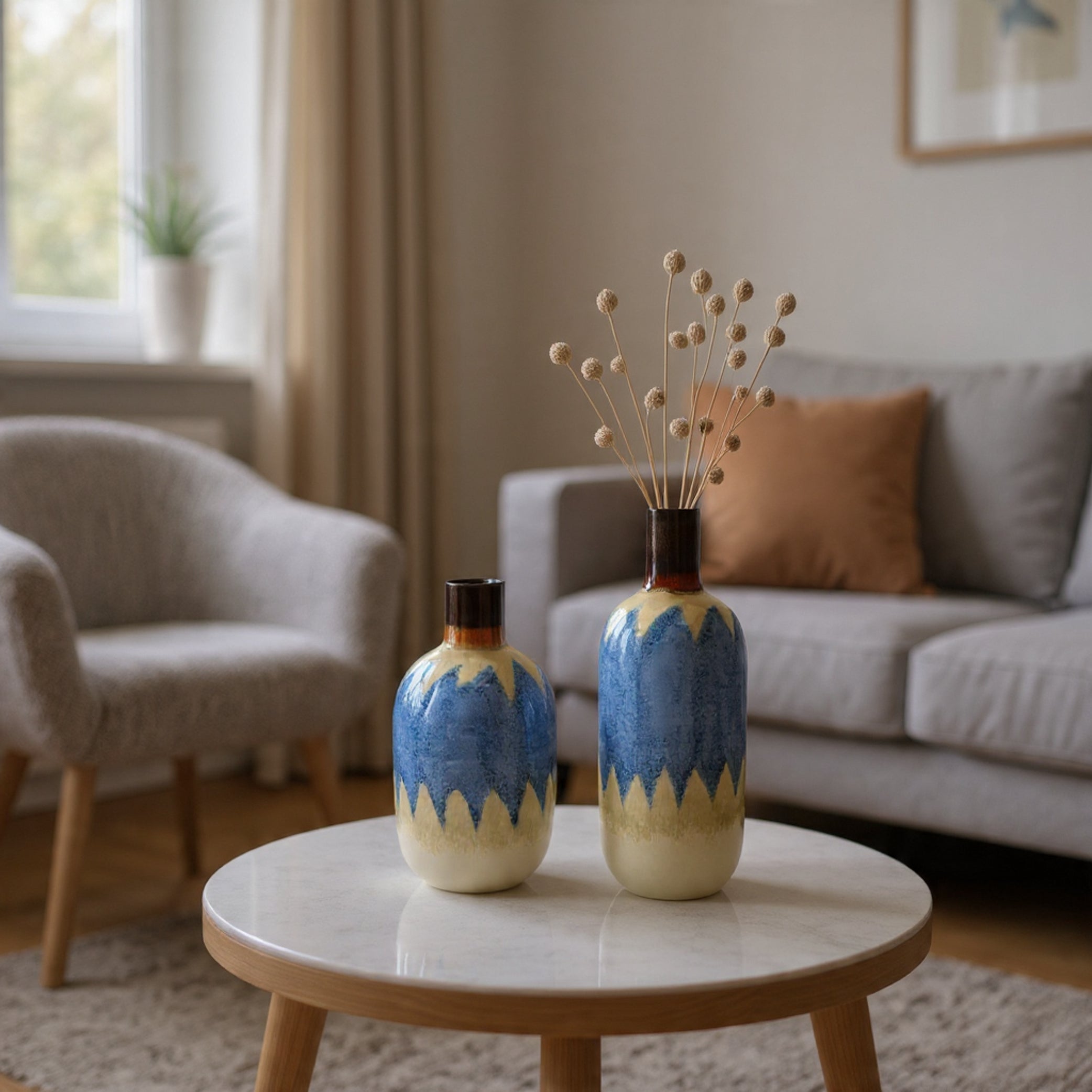 Two decorative vases on a marble table in a living room setting.