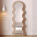 Wavy mirror in a room with panelled walls and a ceiling light.