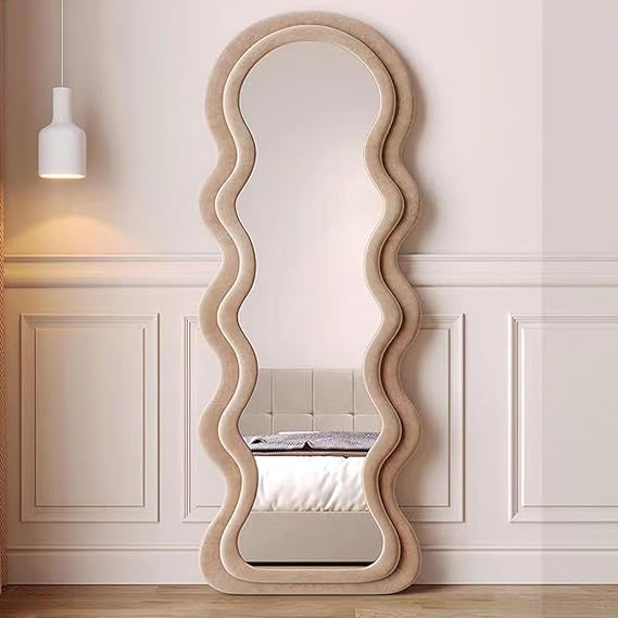 Wavy mirror in a room with panelled walls and a ceiling light.