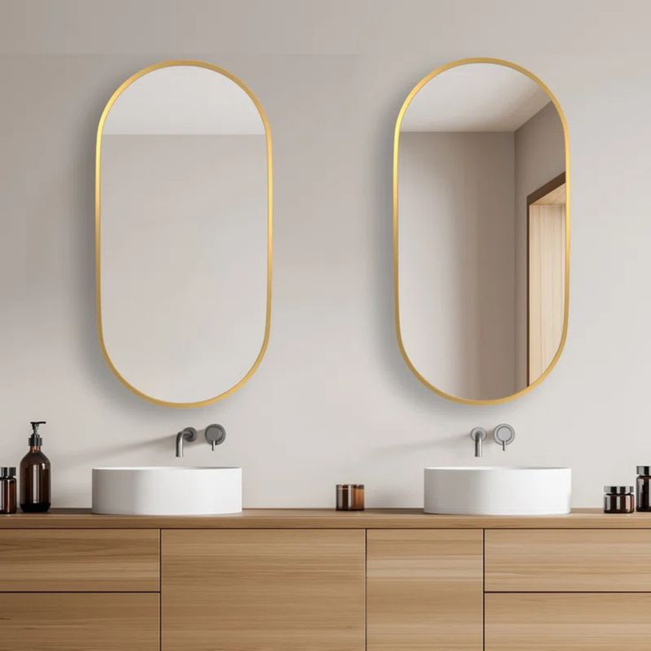 Bathroom vanity with two oval mirrors and wooden cabinets.
