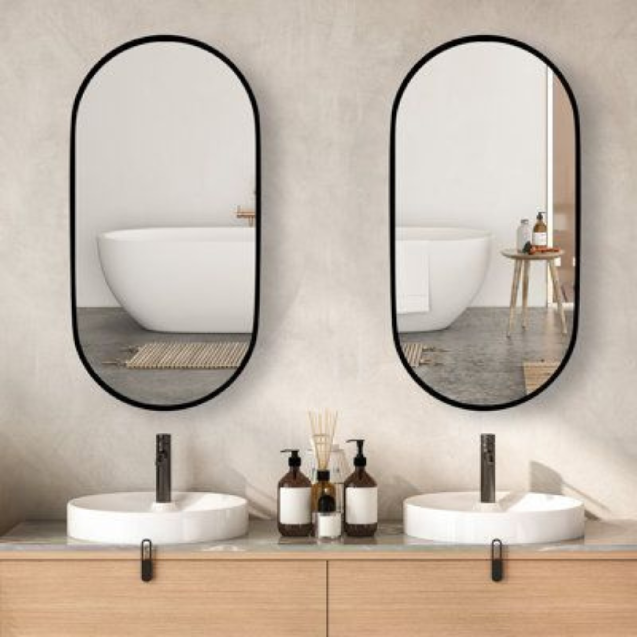 Bathroom vanity with two oval mirrors, white sinks, and various toiletries.