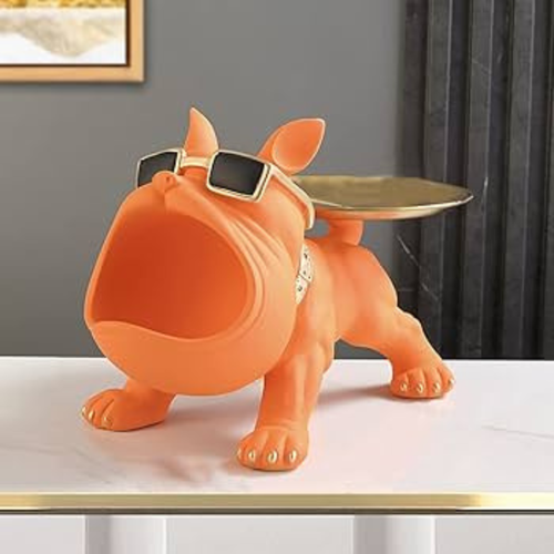 Orange bulldog-shaped table with sunglasses on a white surface